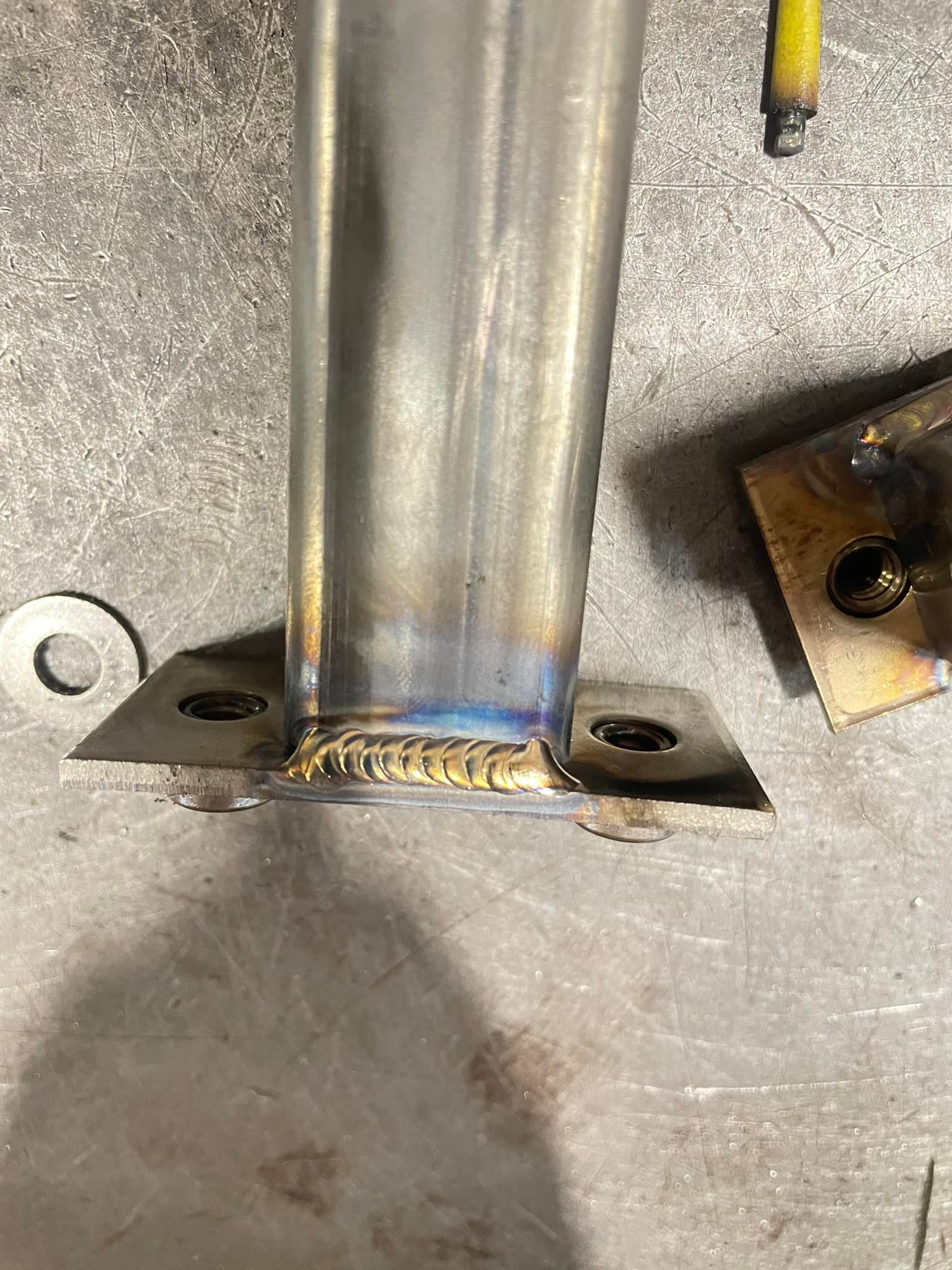 A close up of a metal pipe on a table.