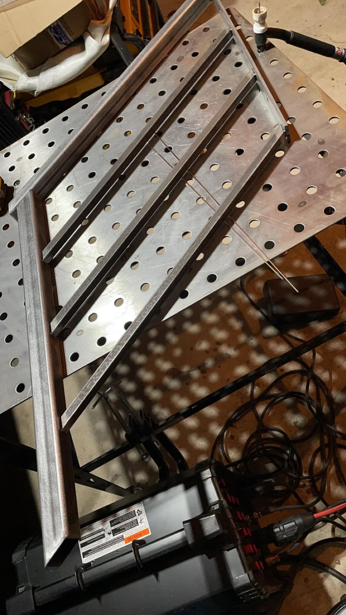 A piece of metal is sitting on top of a table.