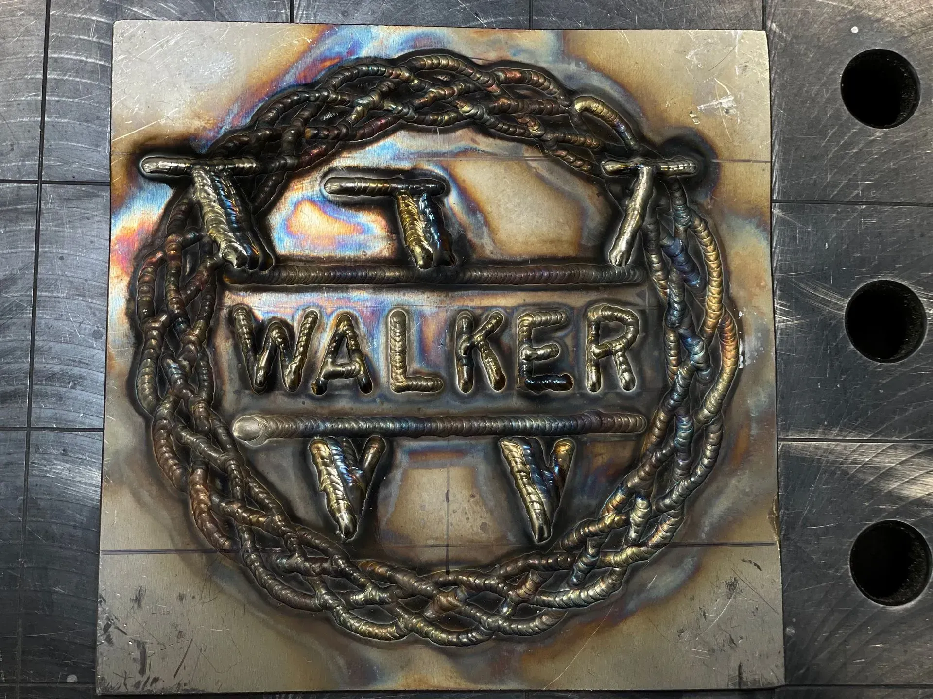 A metal emblem that says walker on it