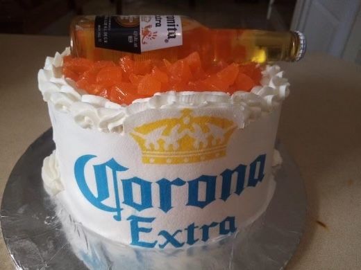 A cake with corona extra written on it