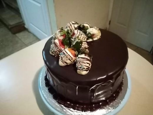 A chocolate cake with strawberries on top of it