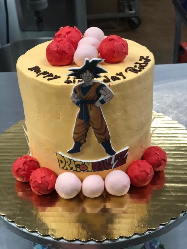 A cake with a picture of goku on it