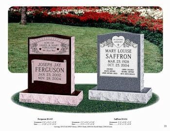 Two granite headstones with engraved inscriptions stand on a grassy lawn with a floral background.