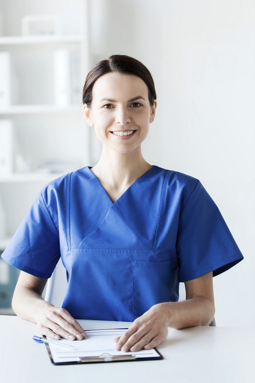 Happy Nurse Holding A Clipboard — Hyannis, MA — Cherry's Home Care