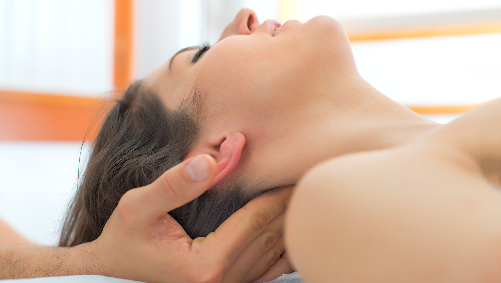 A woman getting a neck massage
