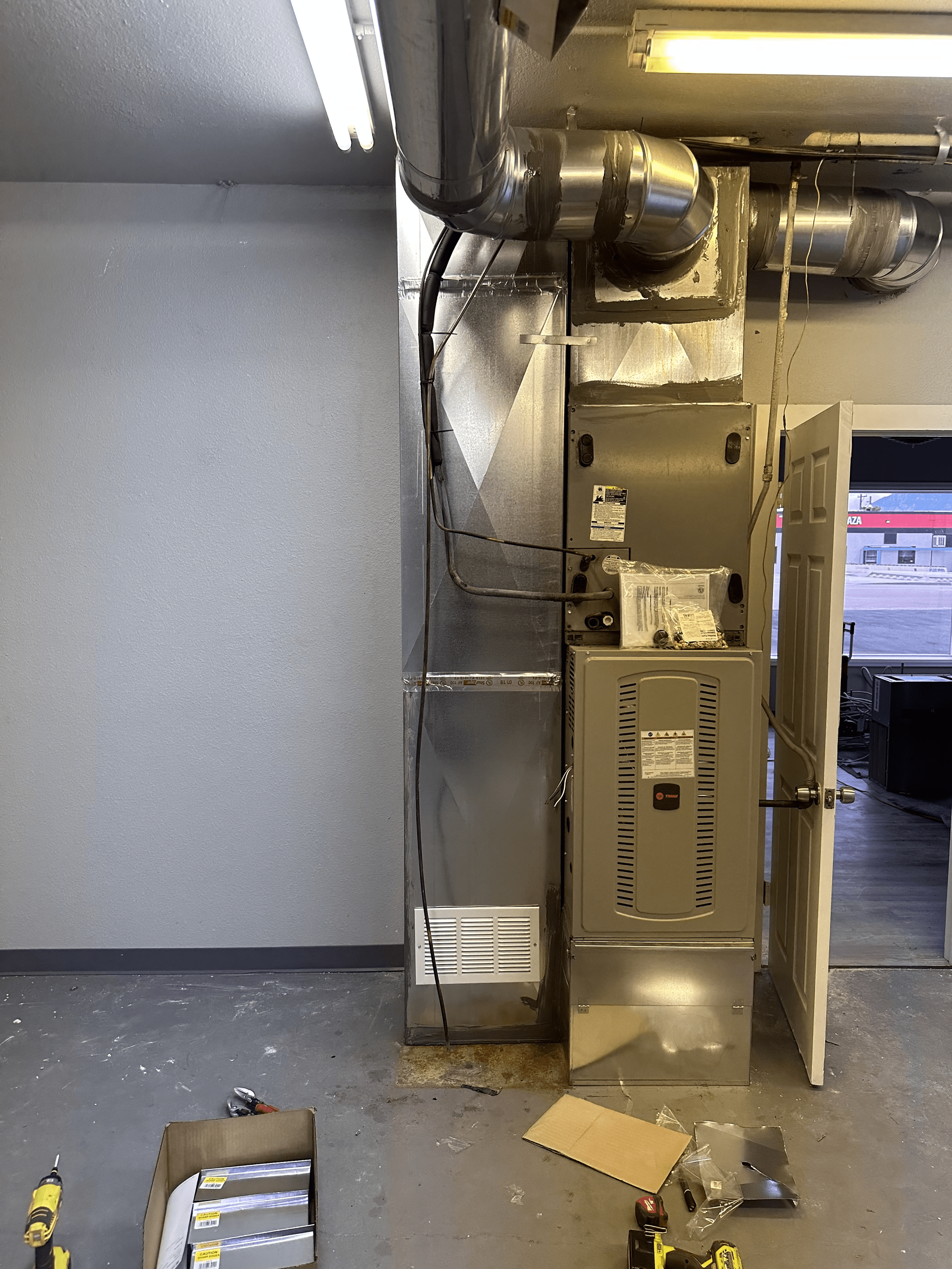 Air Conditioner is Being Installed in a Room — Broomfield, CO — Anytime Heating and Cooling LLC