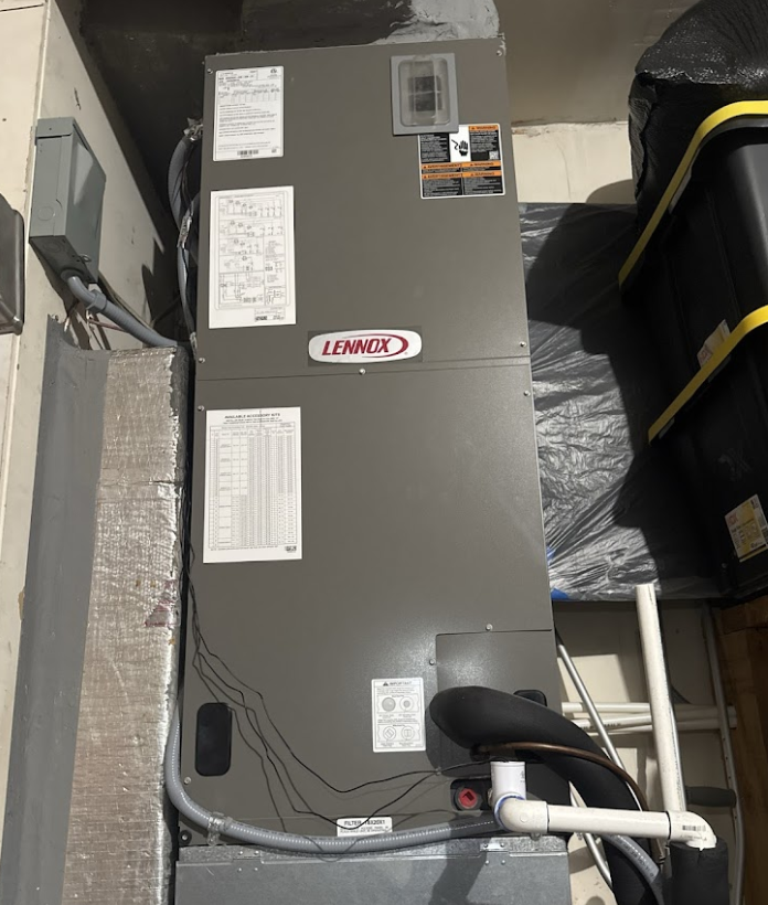 A lennox air conditioner is sitting in a room