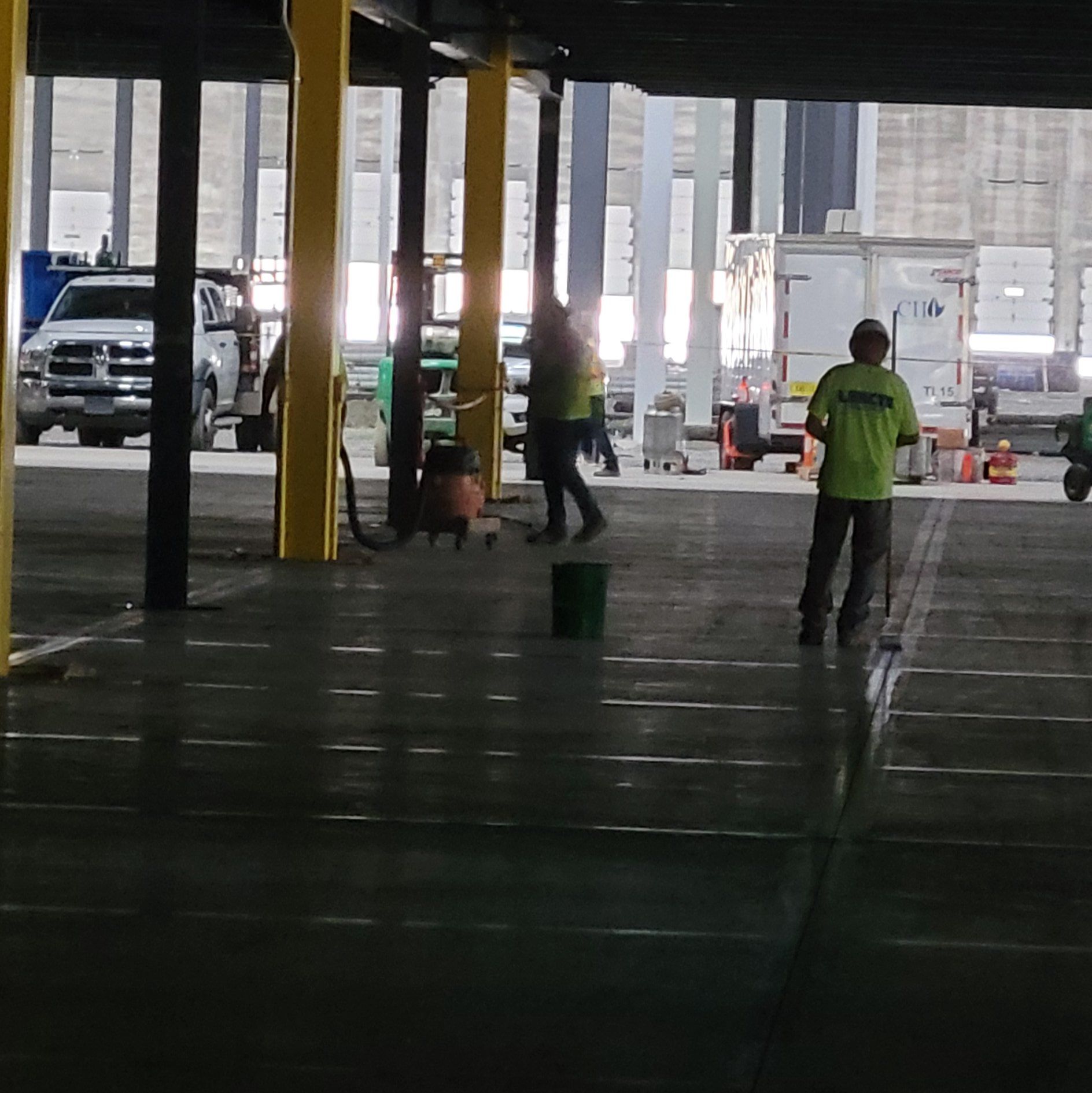 Ameriseal is cleaning up the finishing sand to complete the caulking job in this parking garage
