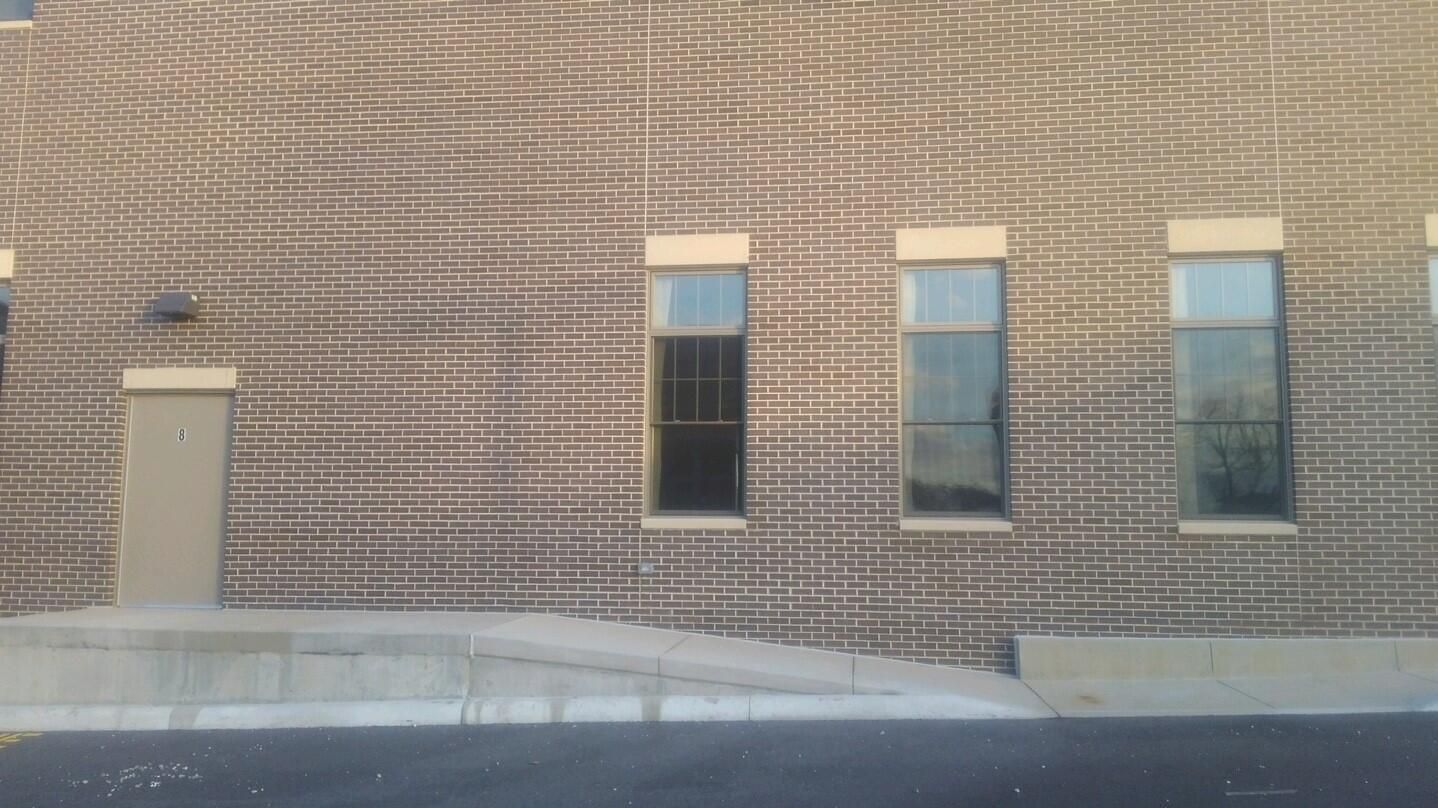 Photo of a new brick building that has been cleaned off after construction related messes