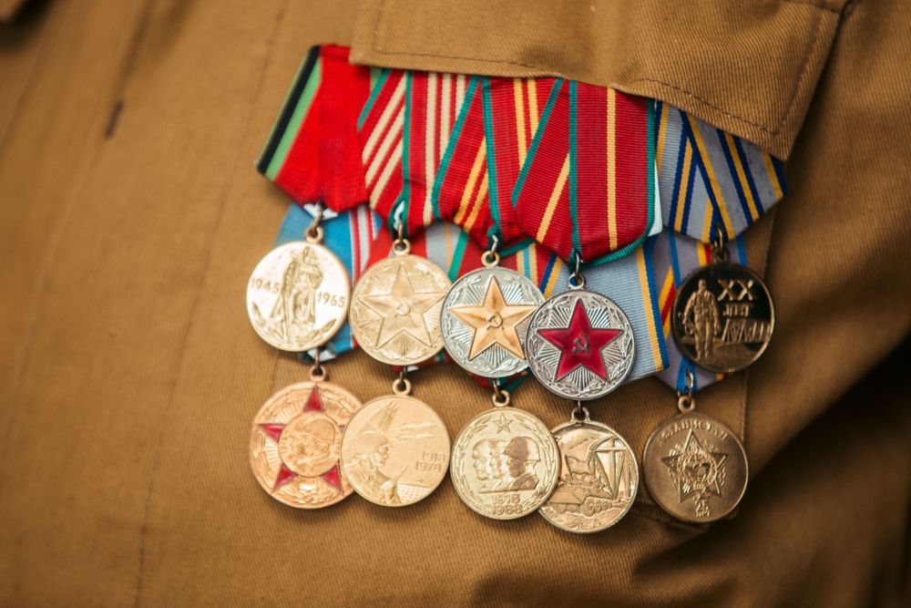 Close-up of a Tan Uniform Jacket With a Series of Medals — Tropical North Framing Gallery Cairns in Atherton Tablelands, QLD