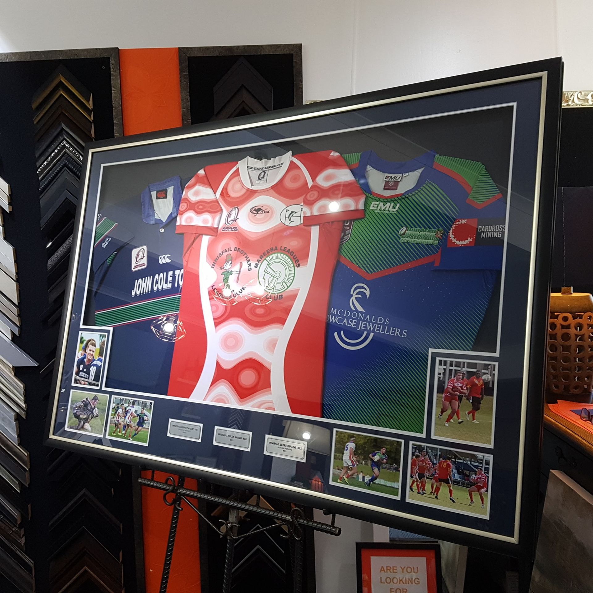 Framed Jerseys and Photos in a Shop Display — Tropical North Framing Gallery Cairns in Atherton Tablelands, QLD