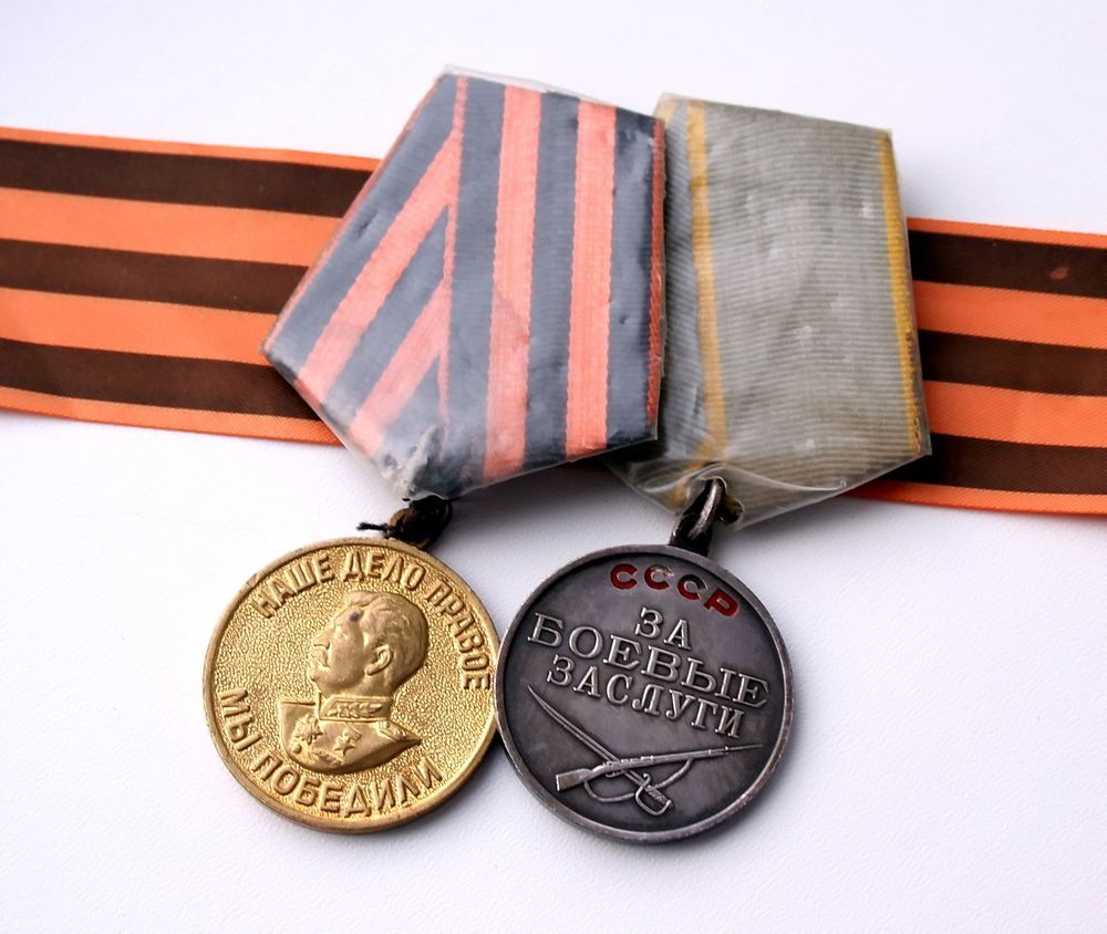 Two Military Medals Resting on a Striped Ribbon — Tropical North Framing Gallery Cairns in Bungalow, QLD