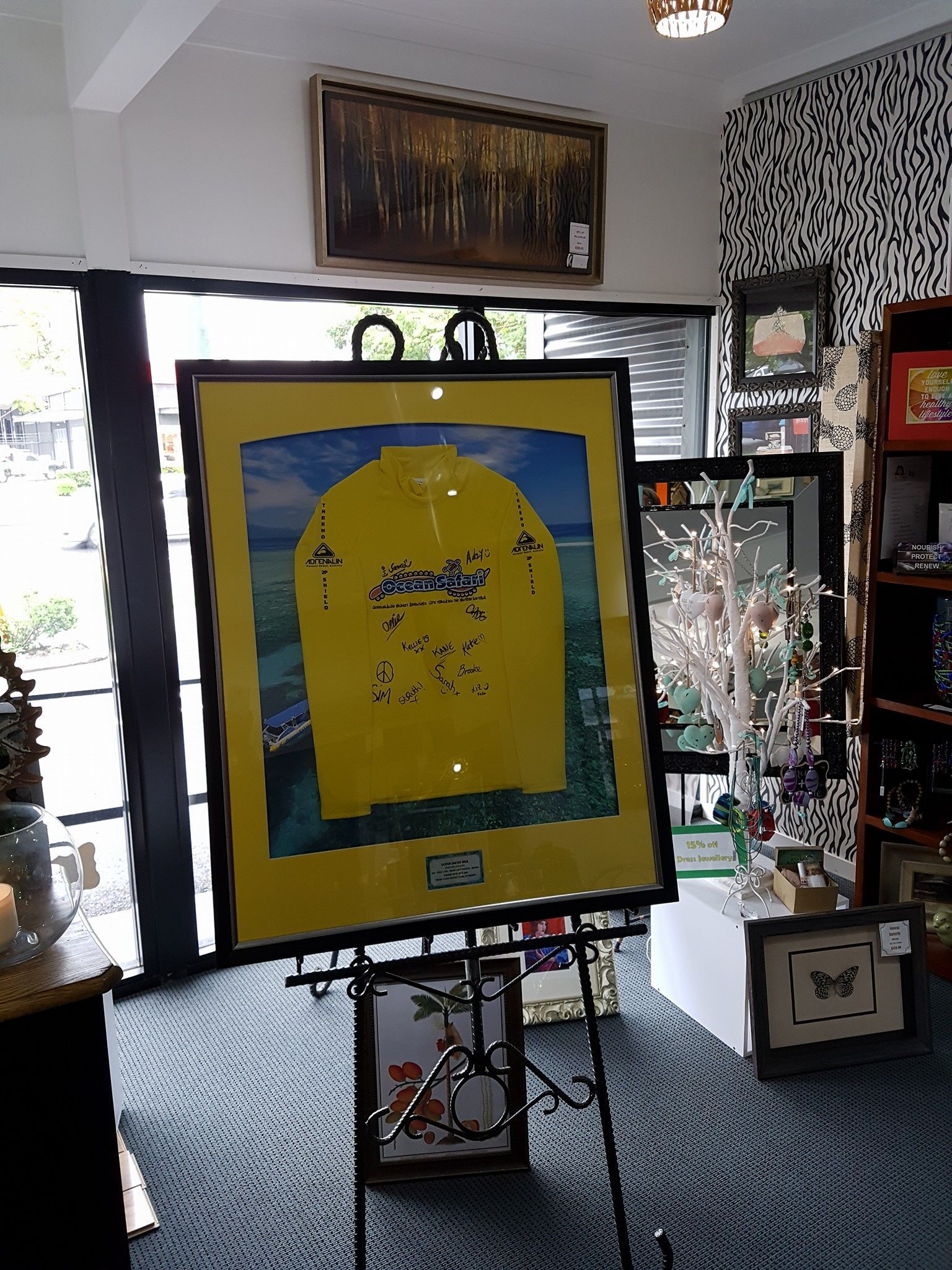 Framed Yellow Suit Displayed in a Store — Tropical North Framing Gallery Cairns in Cairns, QLD
