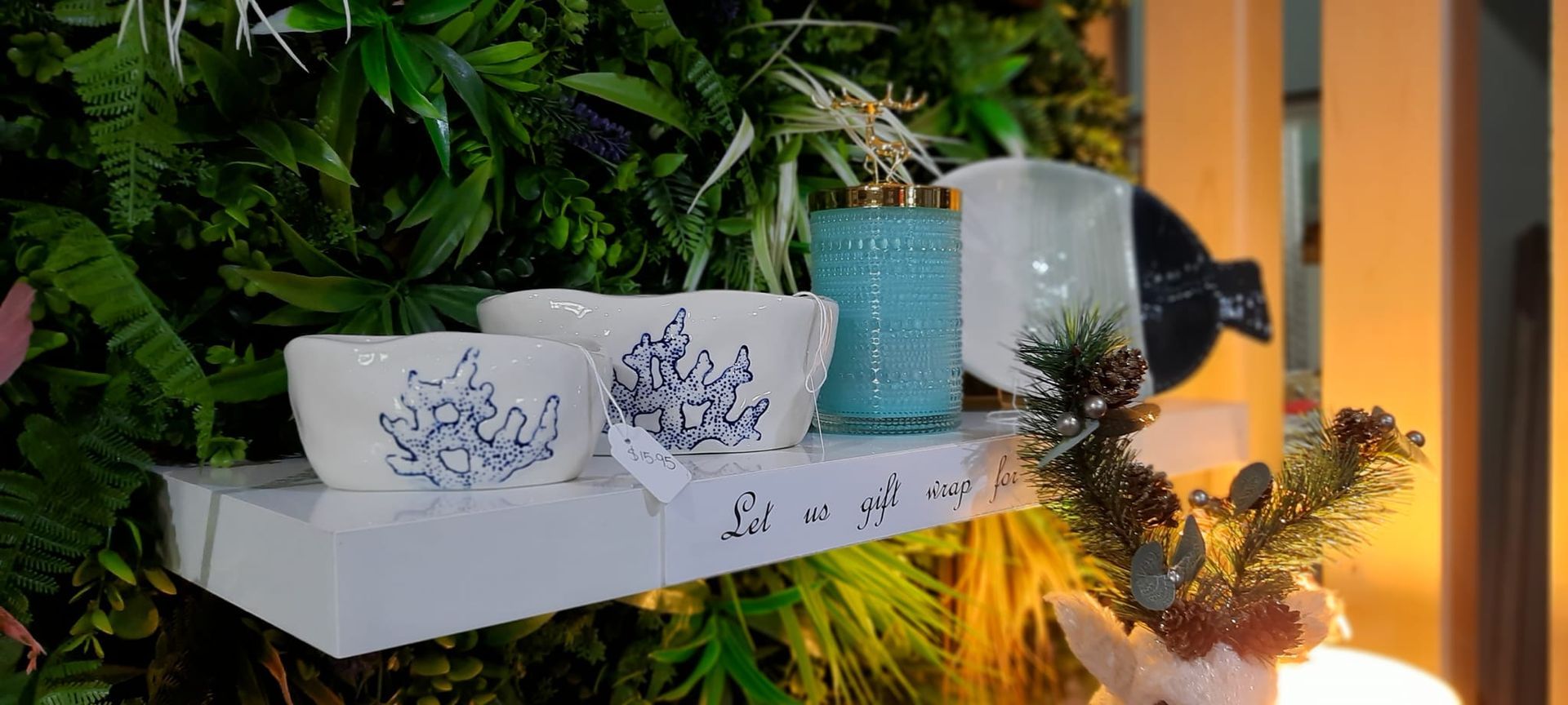 White Bowls, Turquoise Candle, and Greenery on a White Shelf — Tropical North Framing Gallery Cairns in Cairns, QLD