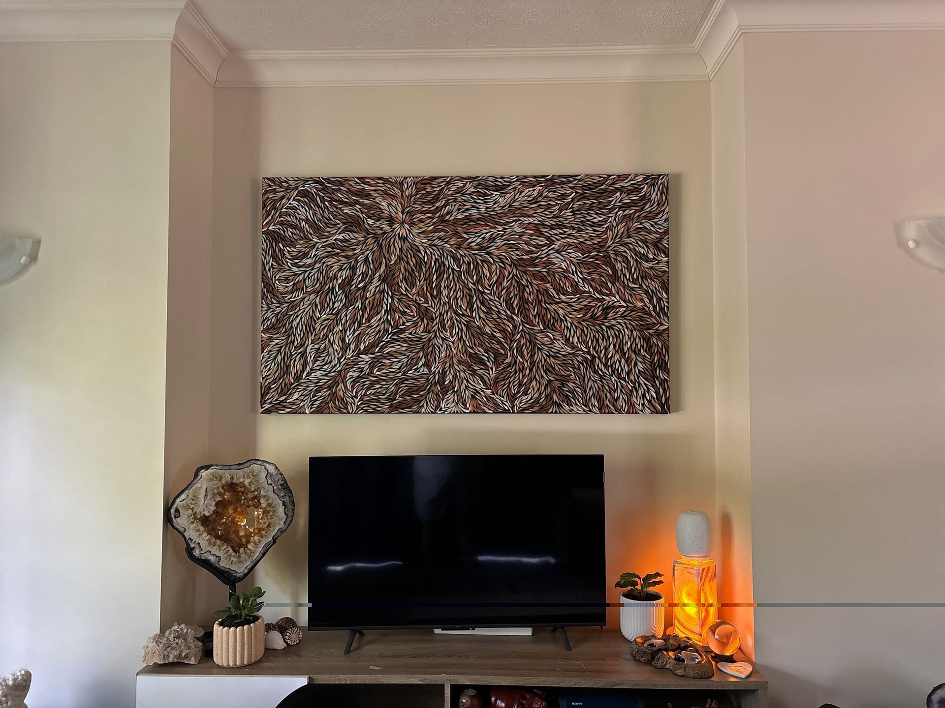 A Living Room With a Large Abstract Painting Above a TV — Tropical North Framing Gallery Cairns in Atherton Tablelands, QLD