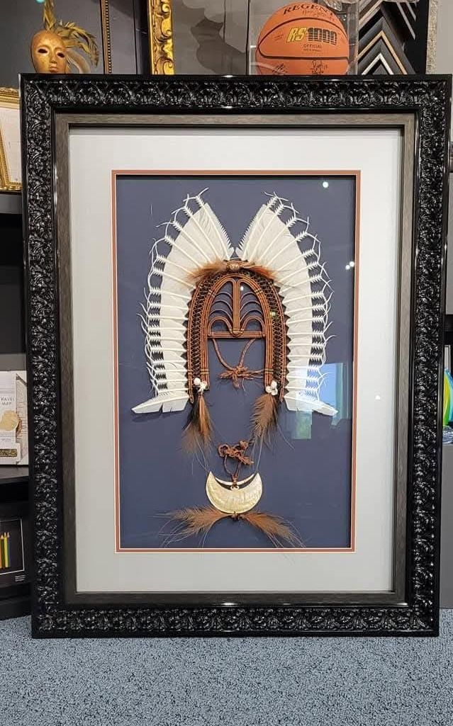 Framed Yellow Suit Displayed in a Store — Tropical North Framing Gallery Cairns in Cairns, QLD