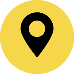 A black pin icon in a yellow circle.