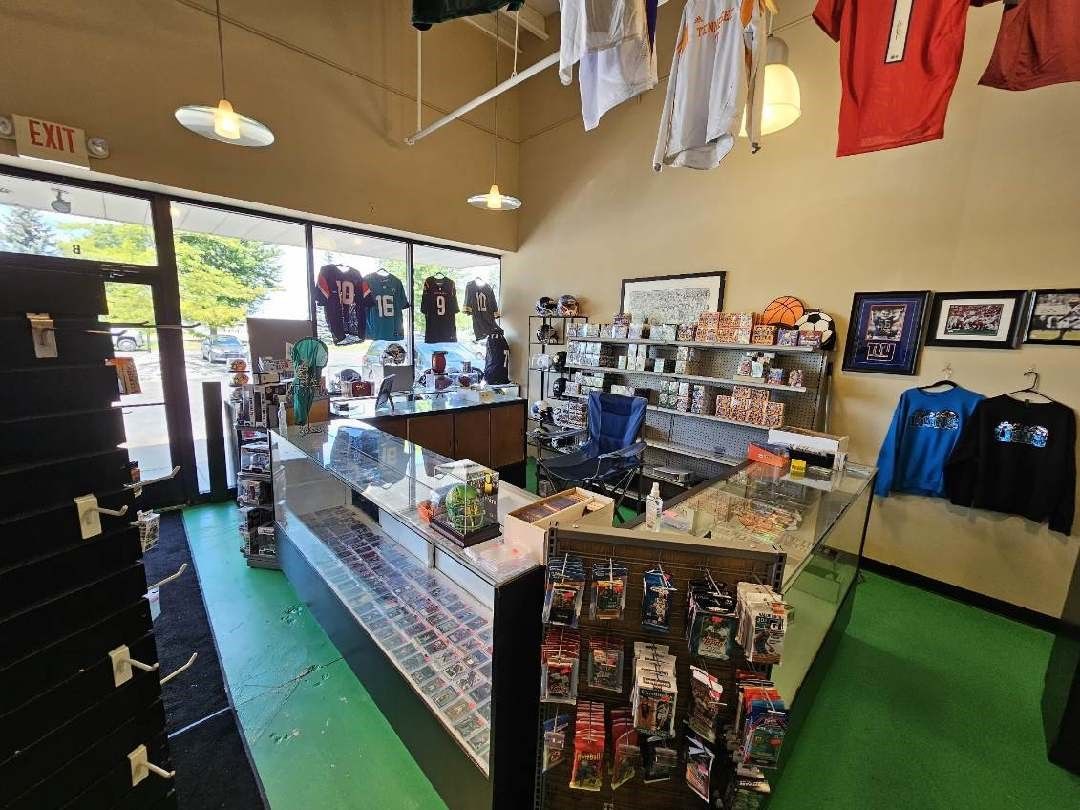 A shelf with a bunch of pokemon cards on it