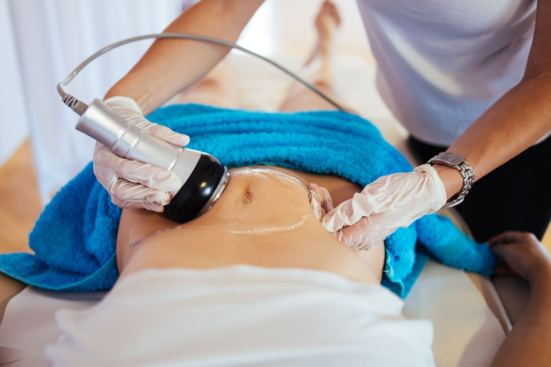 a man and a woman are getting a massage at a spa .