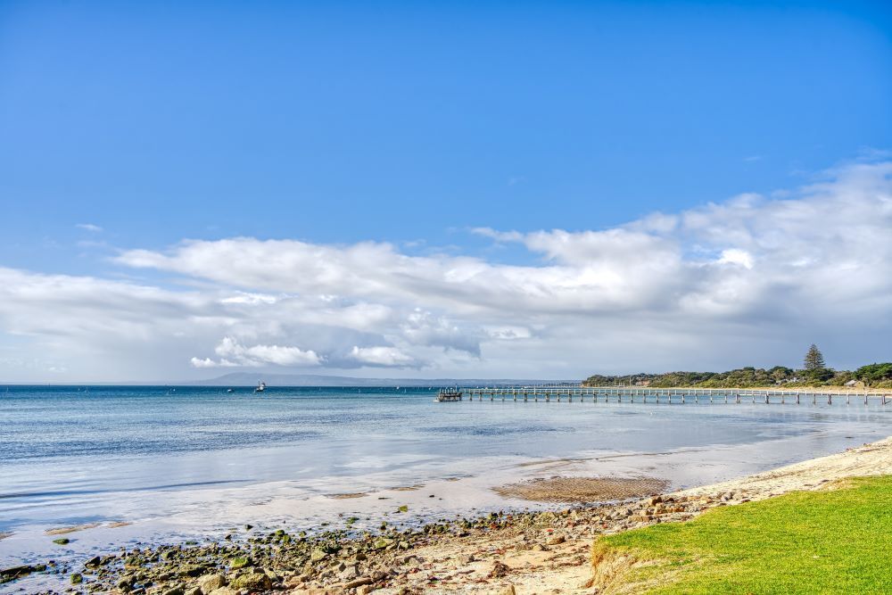 There is a Pier in the Distance Along the Shore of the Ocean — Bellarine Removals In Altona, VIC