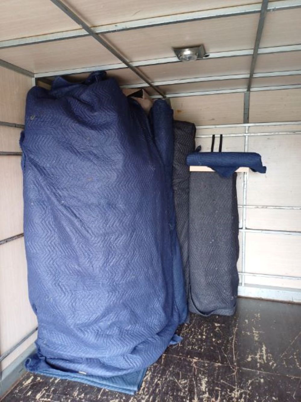 A Blue Blanket is Covering a Large Piece of Furniture — Bellarine Removals In Geelong, VIC