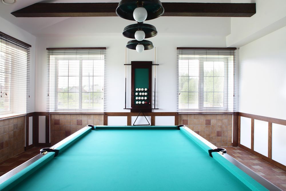 A Pool Table in a Room With a Lot of Windows — Bellarine Removals In Drysdale, VIC