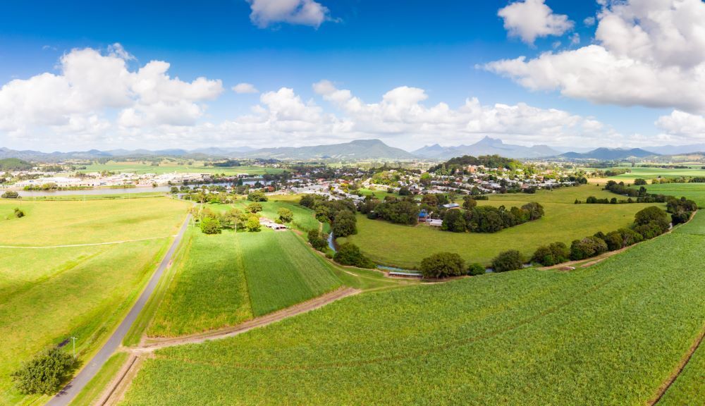 An Aerial View of a Lush Green Field With a Small Town in the Background — Bellarine Removals In Drysdale, VIC