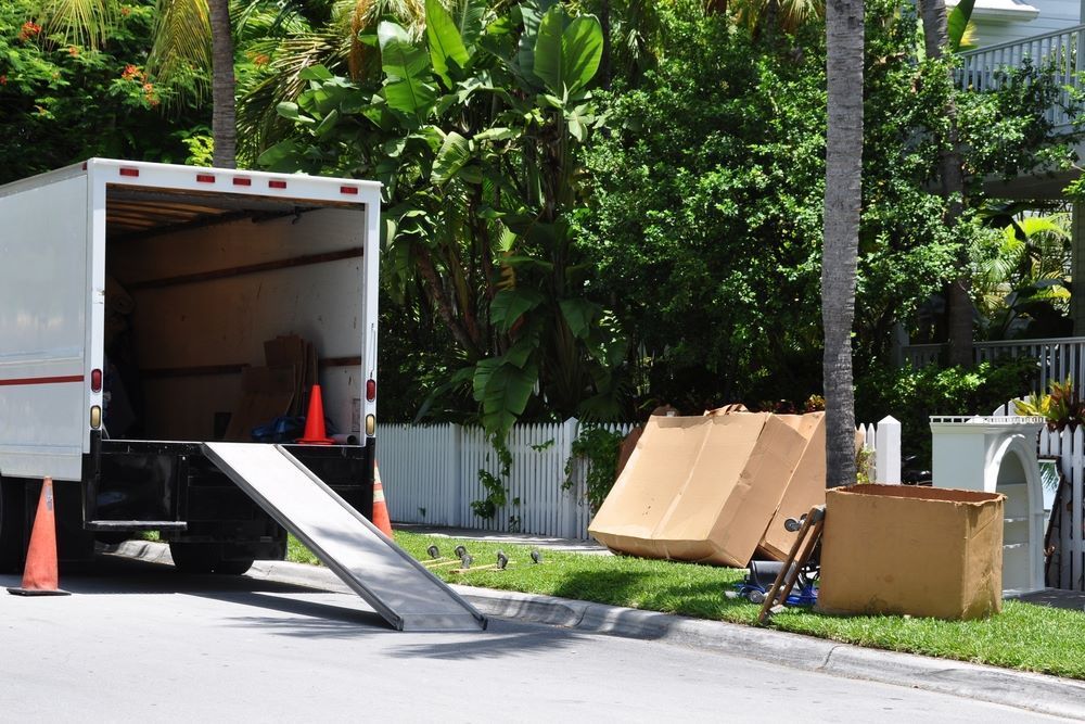 A White Moving Truck is Parked on the Side of the Road — Bellarine Removals In Geelong, VIC