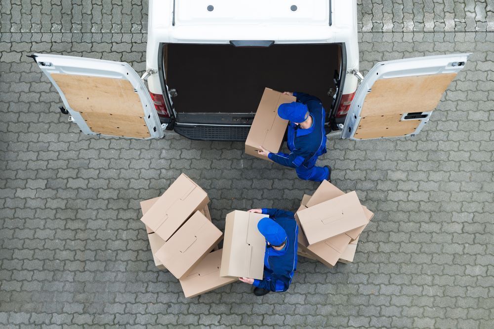 A Classroom With Red Chairs and White Tables — Bellarine Removals In Melbourne, VIC