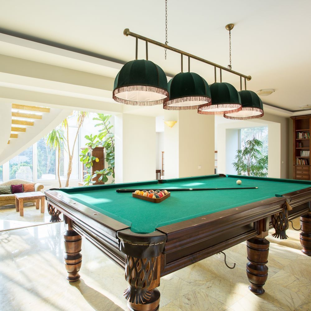 A Pool Table in a Living Room With a Lot of Windows — Bellarine Removals In Ocean Grove, VIC