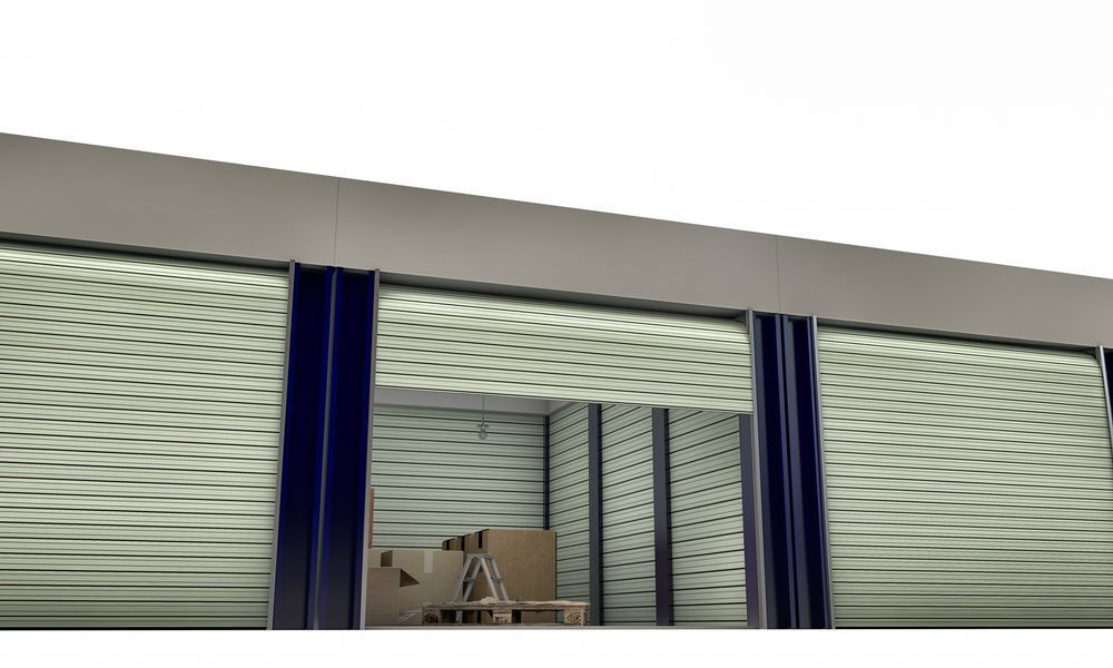 A Warehouse With a Ladder and Boxes Inside of It — Bellarine Removals In Werribee, VIC