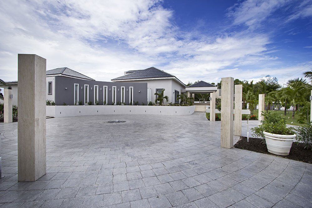 A large house with a driveway leading to it