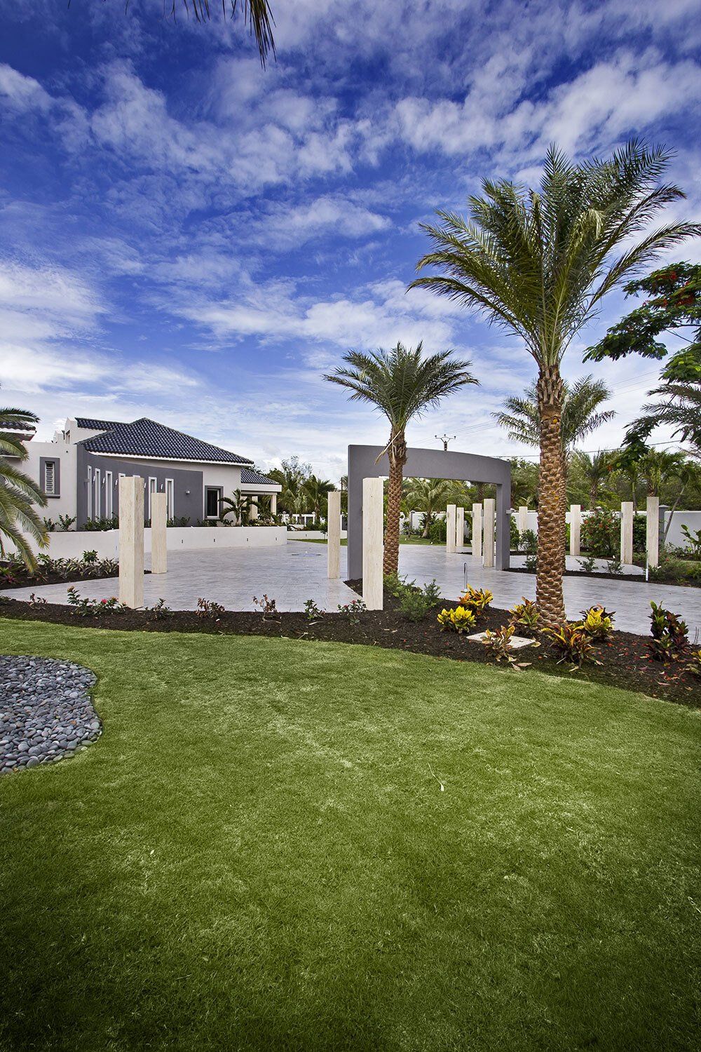 A large house with palm trees in front of it