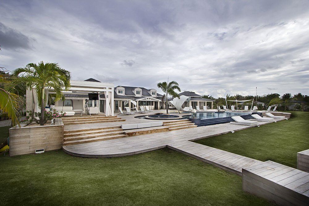A large house with a swimming pool in the backyard