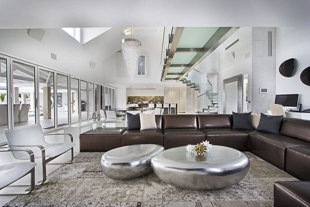 A living room with a couch and two coffee tables