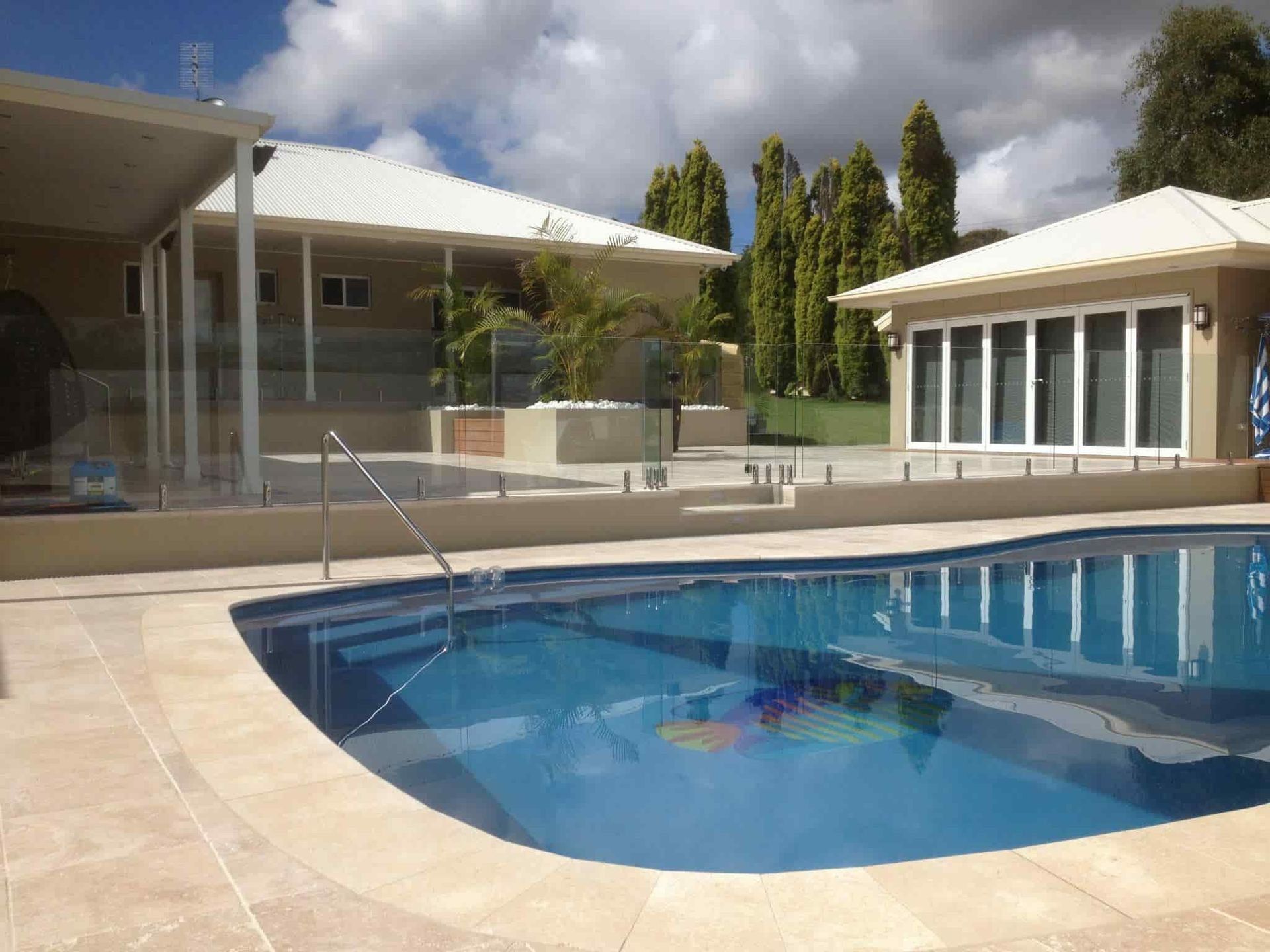 Pool With Blue Water in Front of a House — Divine Landscape Creations in Berkeley Vale, NSW