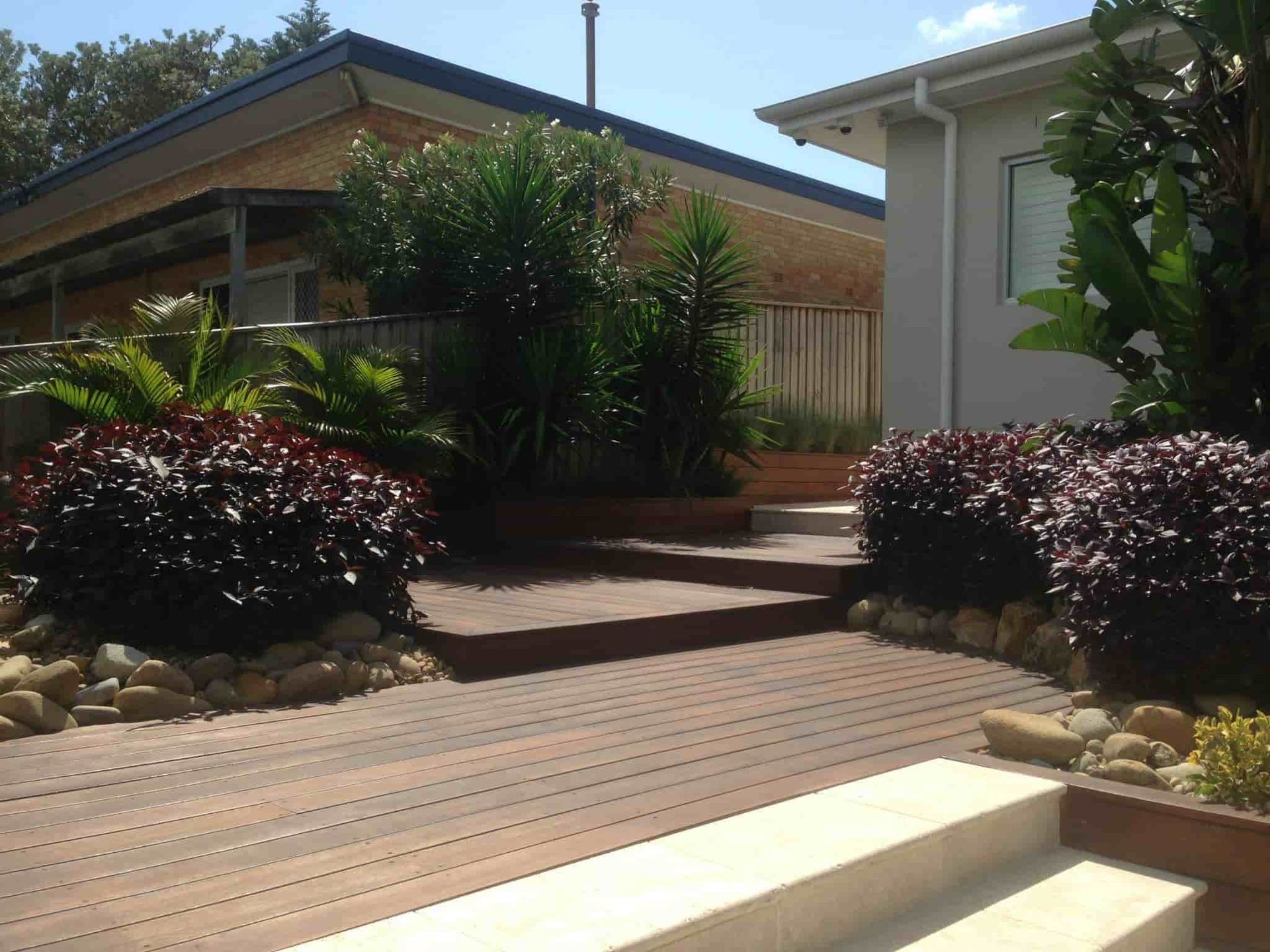 Wooden Deck With Steps Leading to a Garden — Divine Landscape Creations in Avoca Beach, NSW