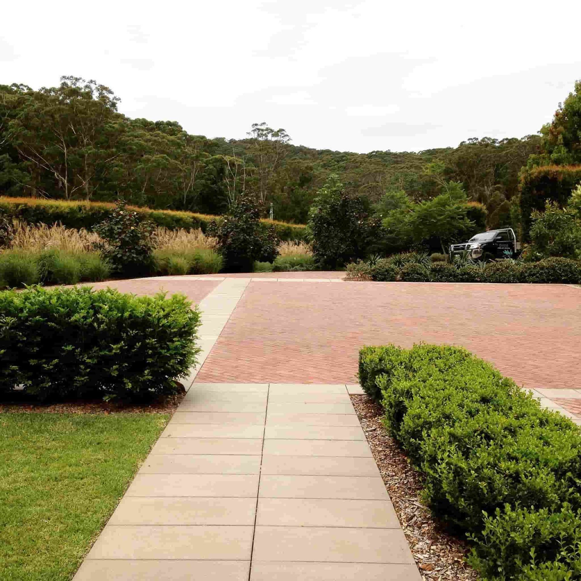 Driveway Paved With Red Bricks — Divine Landscape Creations in Avoca Beach, NSW