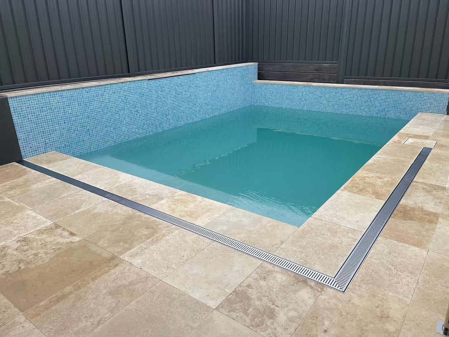 Small, Rectangular Backyard Swimming Pool With Light Blue Tiles — Divine Landscape Creations in Erina, NSW