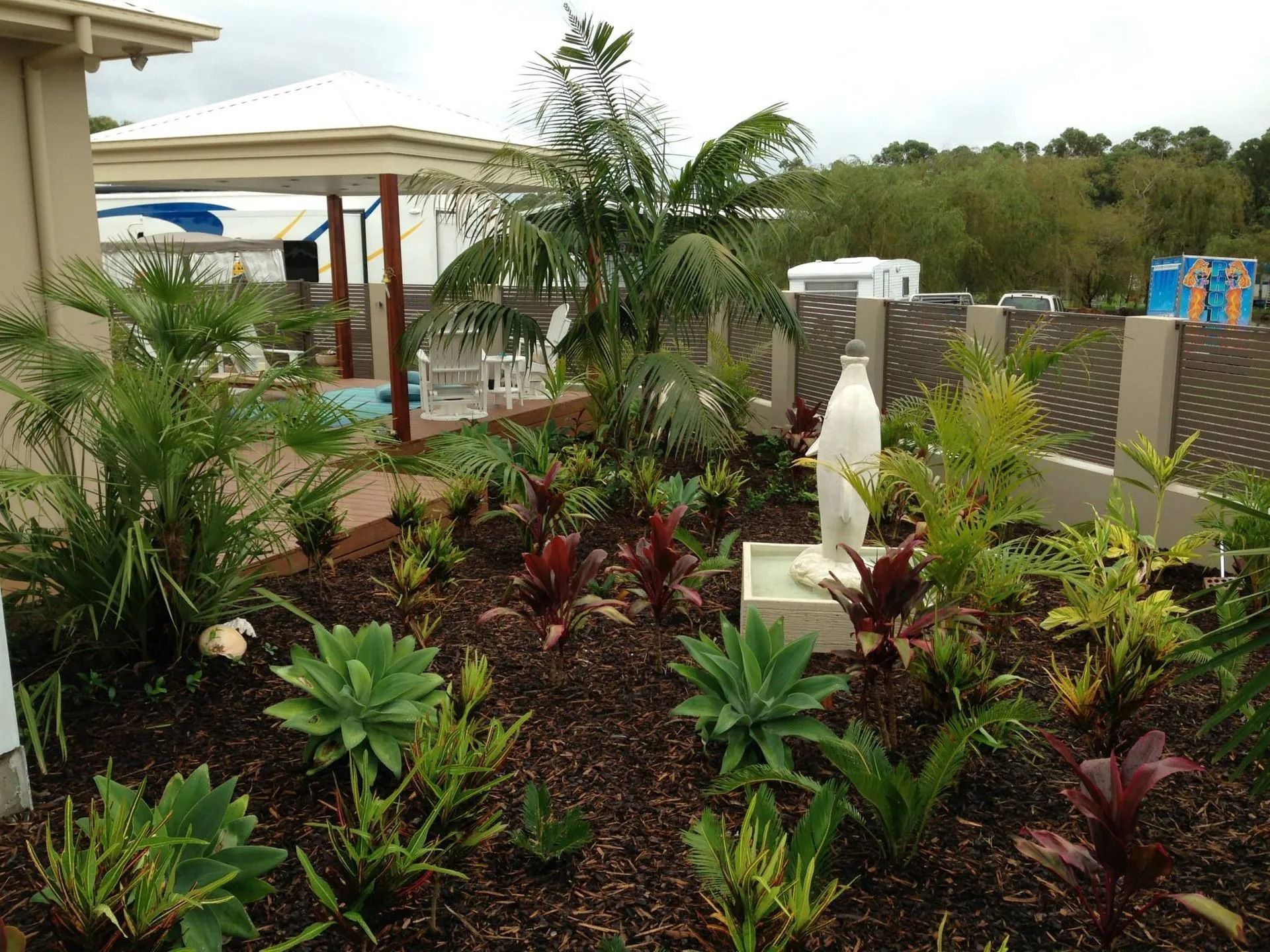 Garden Bed With Statue of the Virgin Mary — Divine Landscape Creations in Tuggerah, NSW