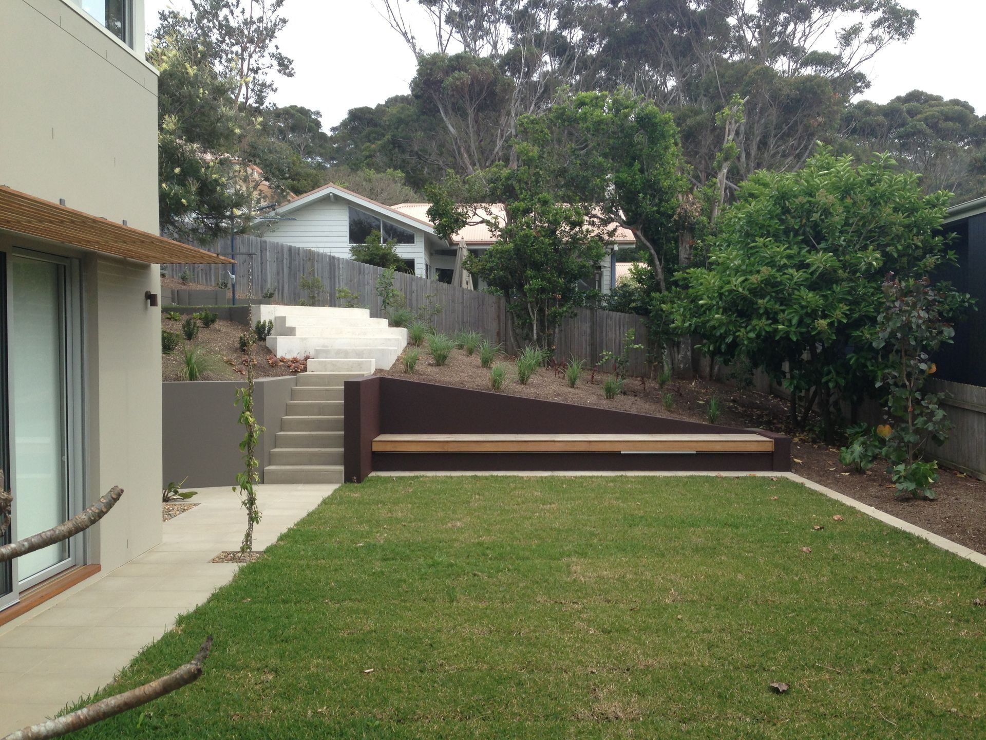 Backyard With a Lawn, Steps, a Retaining Wall — Divine Landscape Creations in Berkeley Vale, NSW