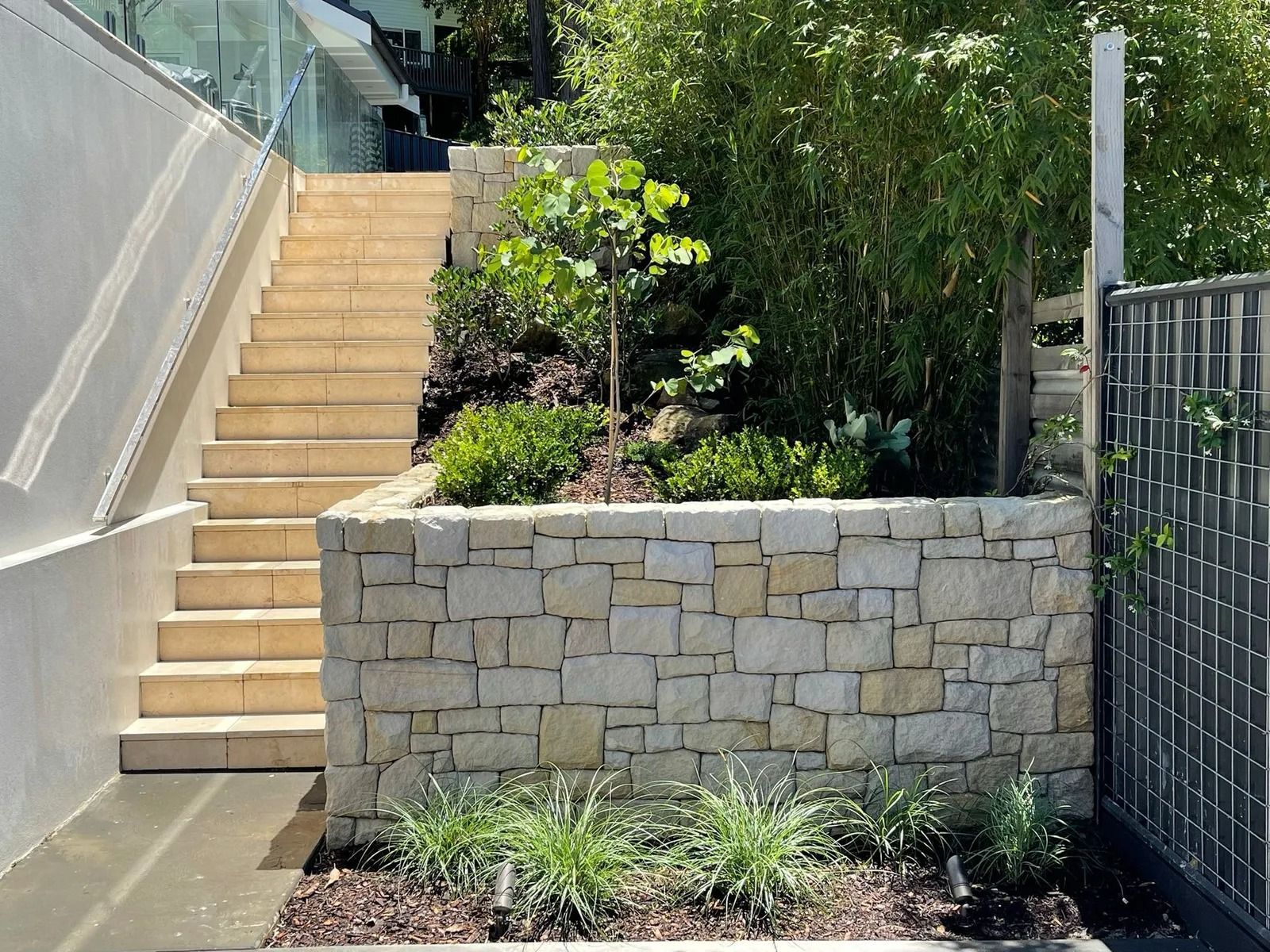 Stone Retaining Wall With Plants — Divine Landscape Creations in Berkeley Vale, NSW