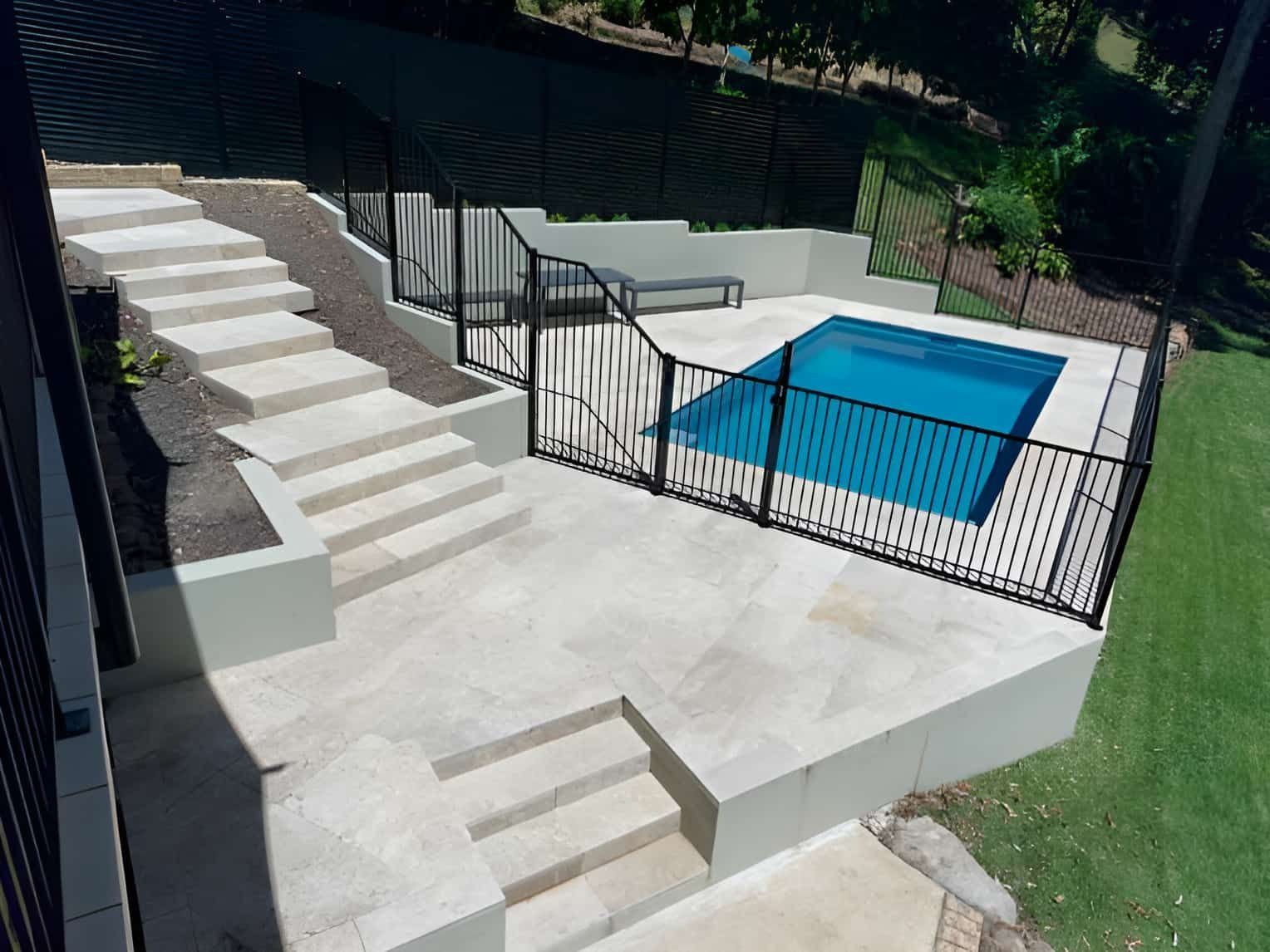 Concrete Steps Leading Down to a Fenced-in, Small, Blue Pool Area — Divine Landscape Creations in Berkeley Vale, NSW