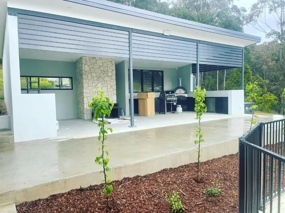 Poolside View of Modern Home — Divine Landscape Creations in Berkeley Vale, NSW