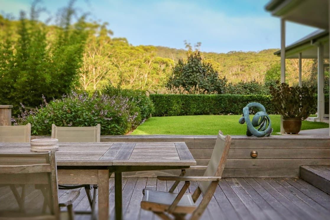 Wooden Deck With Table and Chairs — Divine Landscape Creations in Avoca Beach, NSW