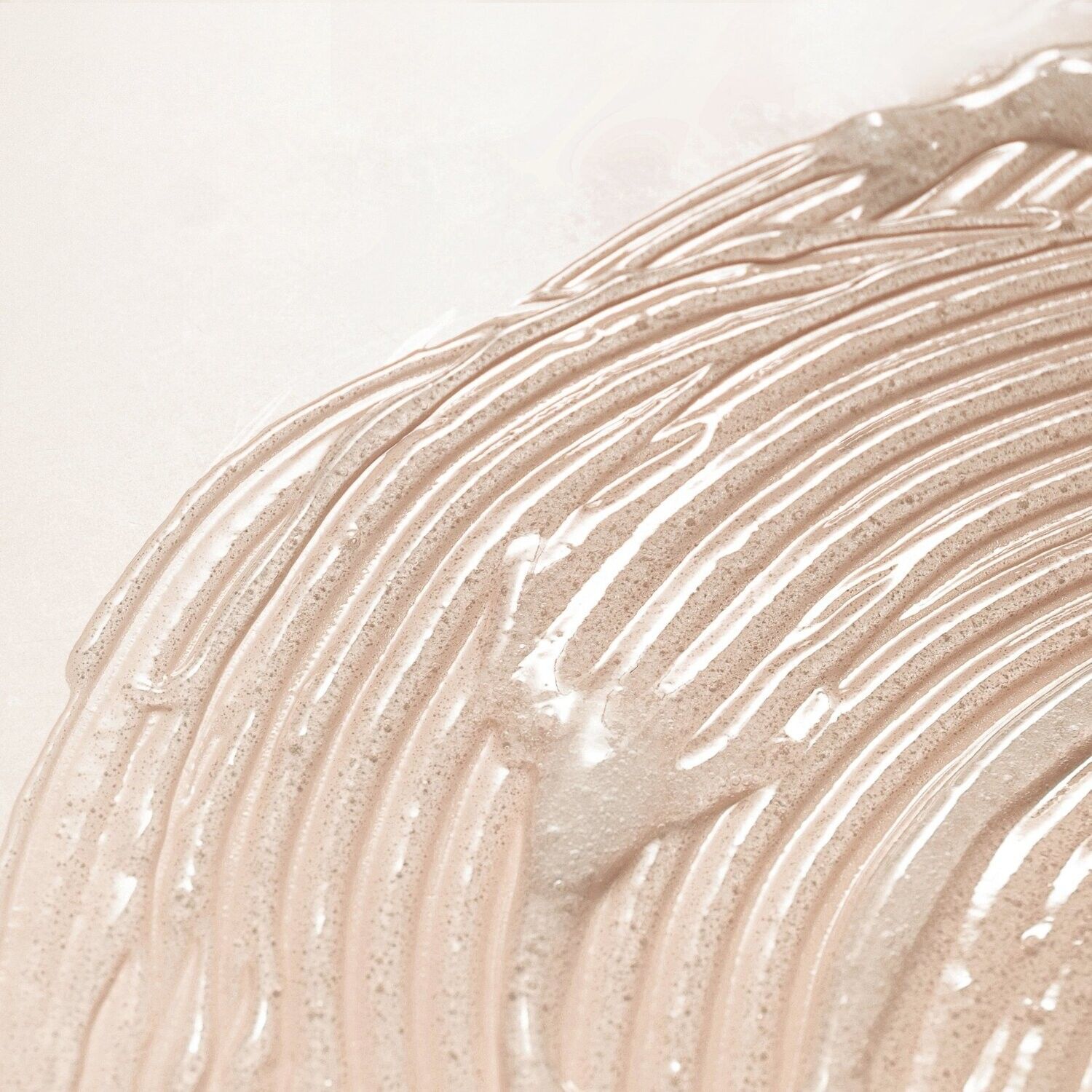 A close up of a creamy substance on a white surface.