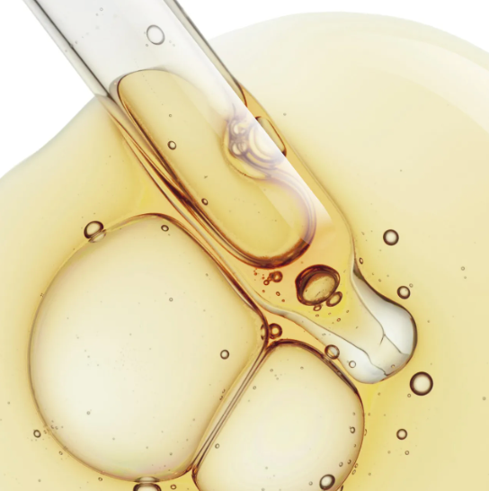 A close up of a dropper filled with liquid