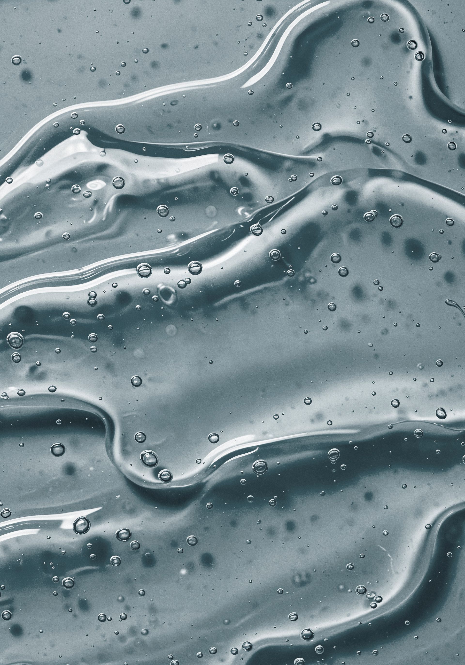 A close up of a liquid with bubbles in it.