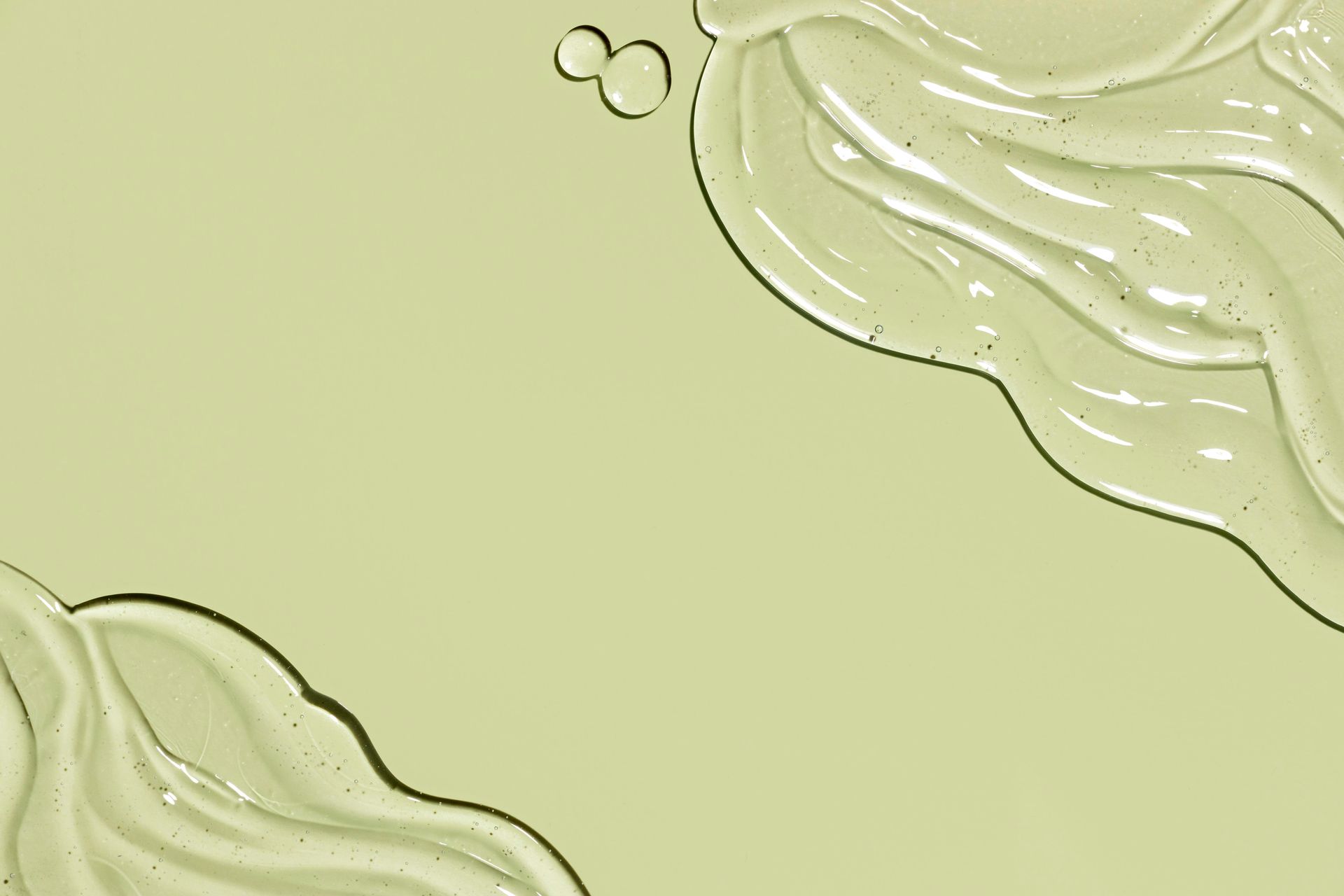 A close up of bubbles in a liquid on a brown surface.