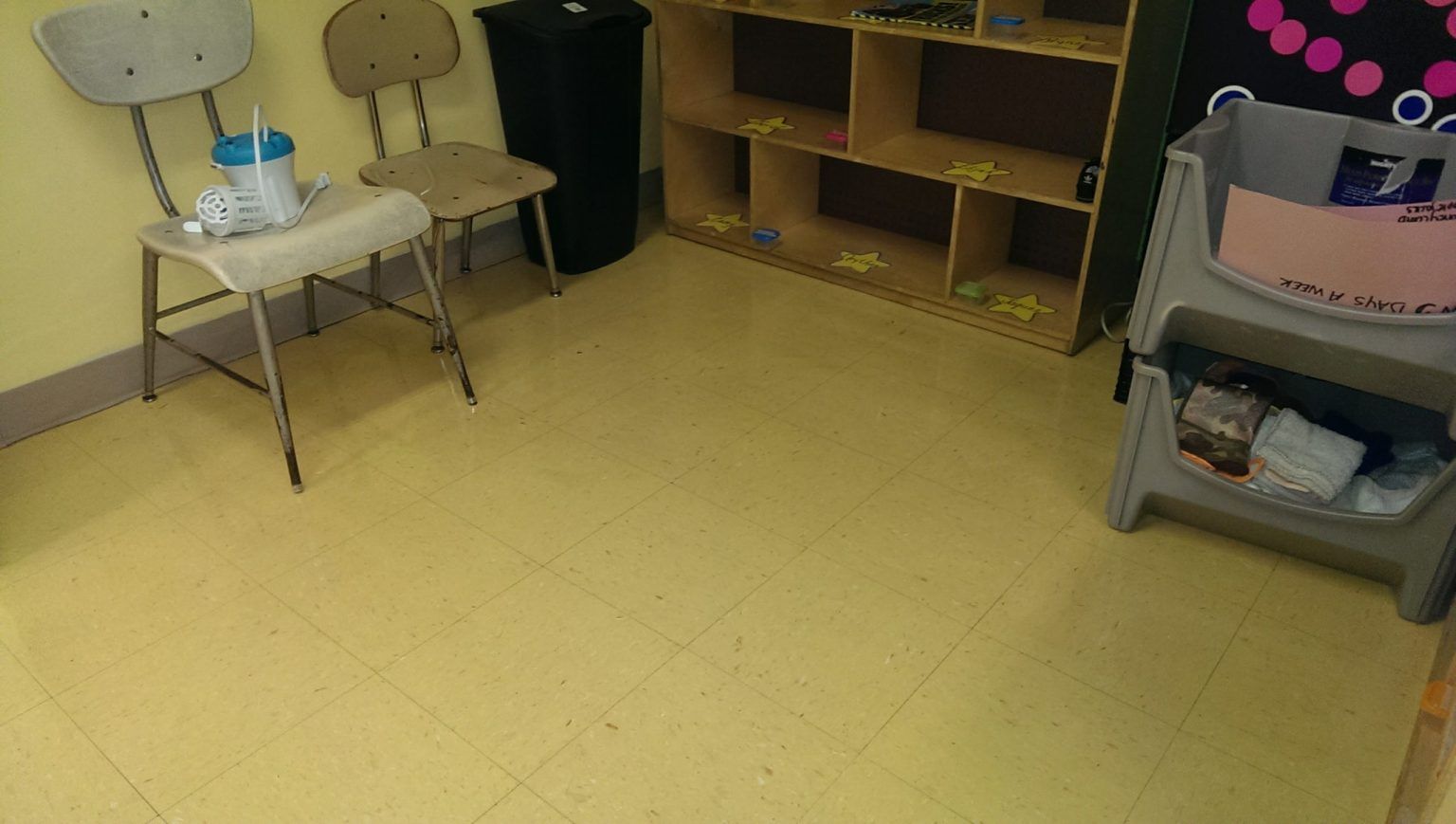 A room with two chairs and a changing table.